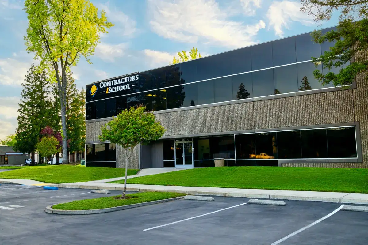 Front entrance of Contractors Intelligence School featuring a modern glass design and welcoming atmosphere.